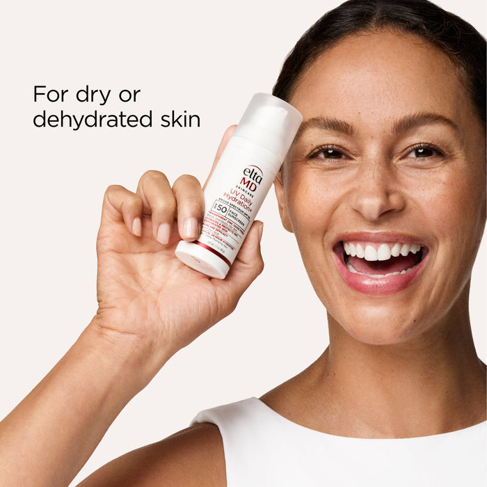 Woman holding a skincare product for dry or dehydrated skin
