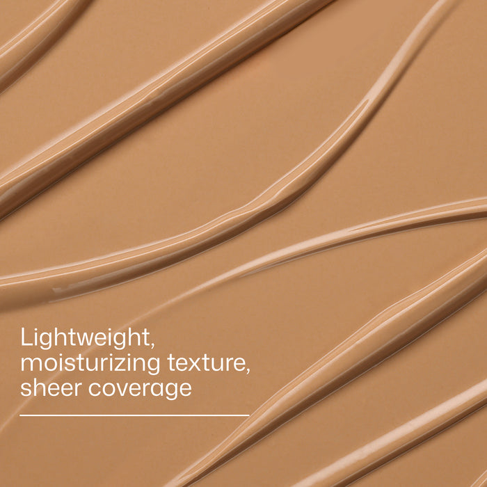 Brown makeup swatch with text describing texture and coverage