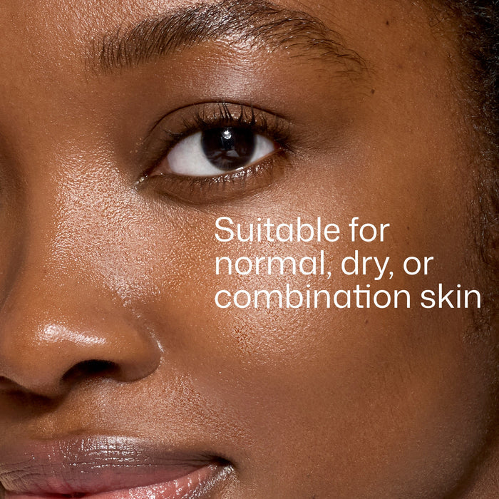 Close-up of a person's eye with text 'Suitable for normal, dry, or combination skin' on a close-up of skin.