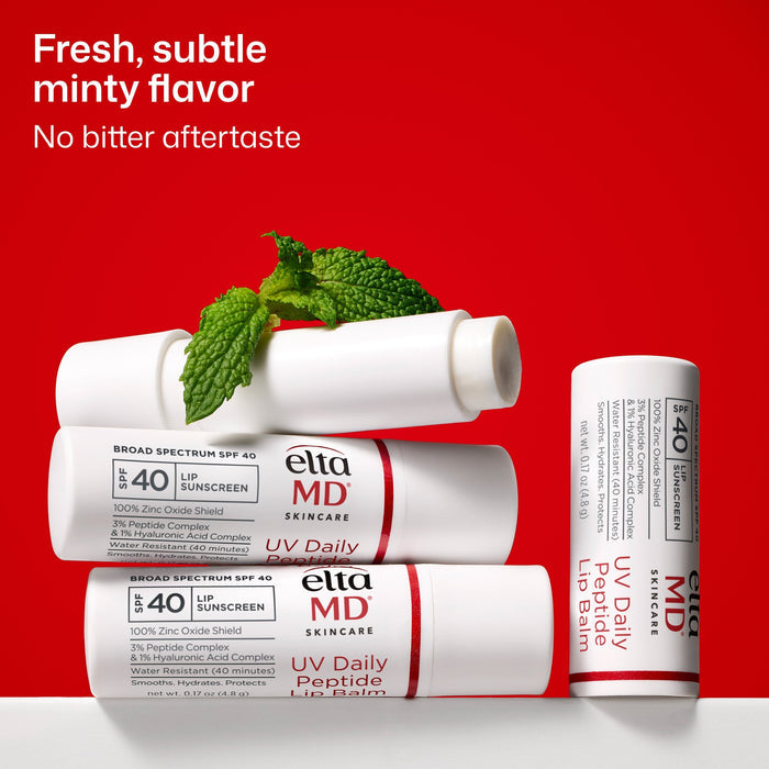 Ella MD lip balm tubes with mint leaves on a red background